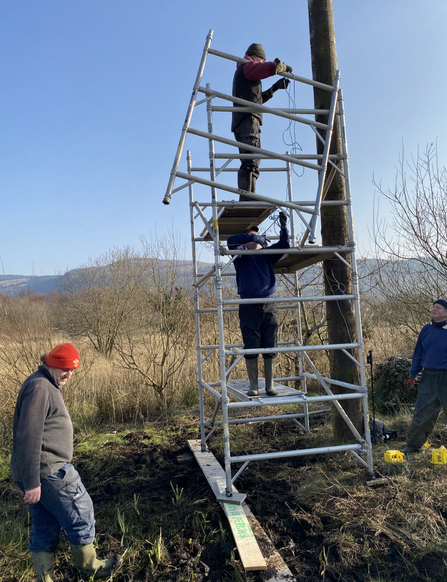 Volunteers putting up scaffolding March 2021